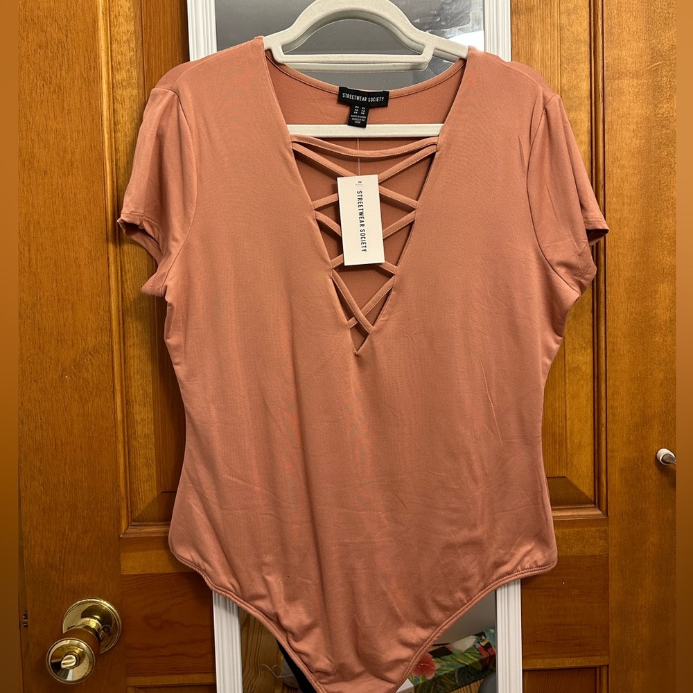 NWT pink low cut body suit size XL